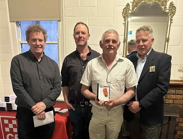 Graham Symons receives Life Membership from DCO Cook